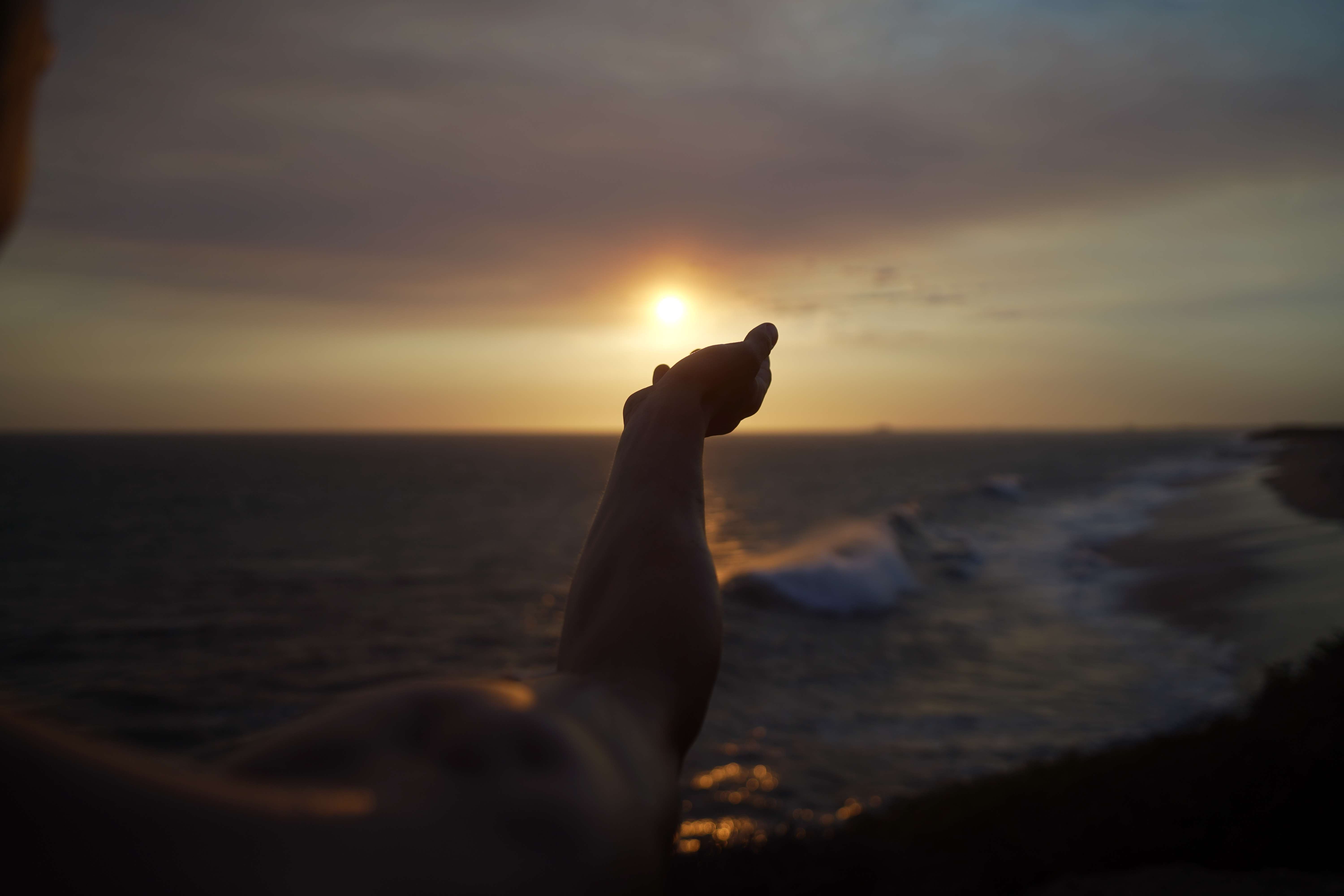Portrait - Dynamic silhouette at oceanside during golden hour