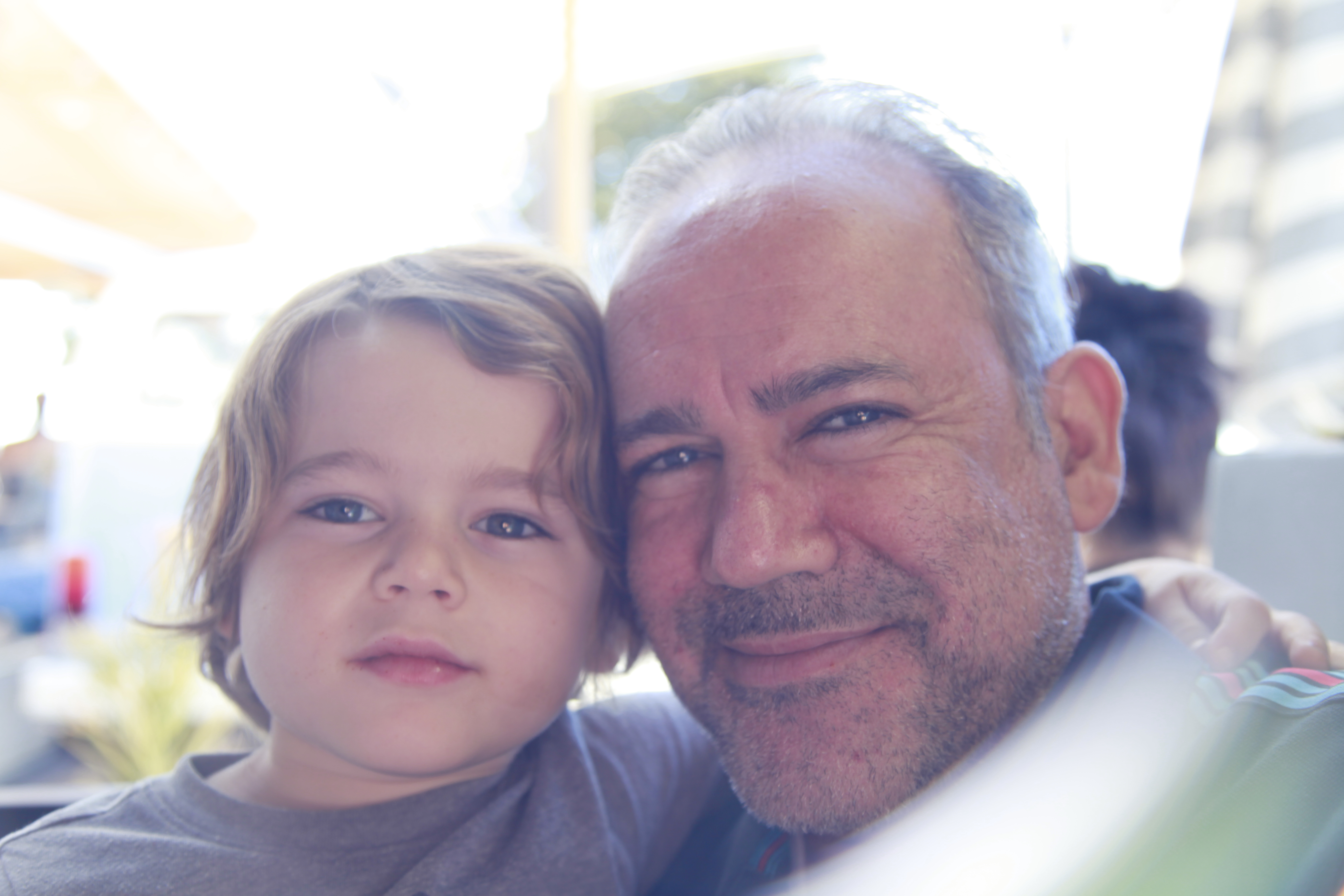 Portrait - Warm family moment with natural lighting and genuine expressions